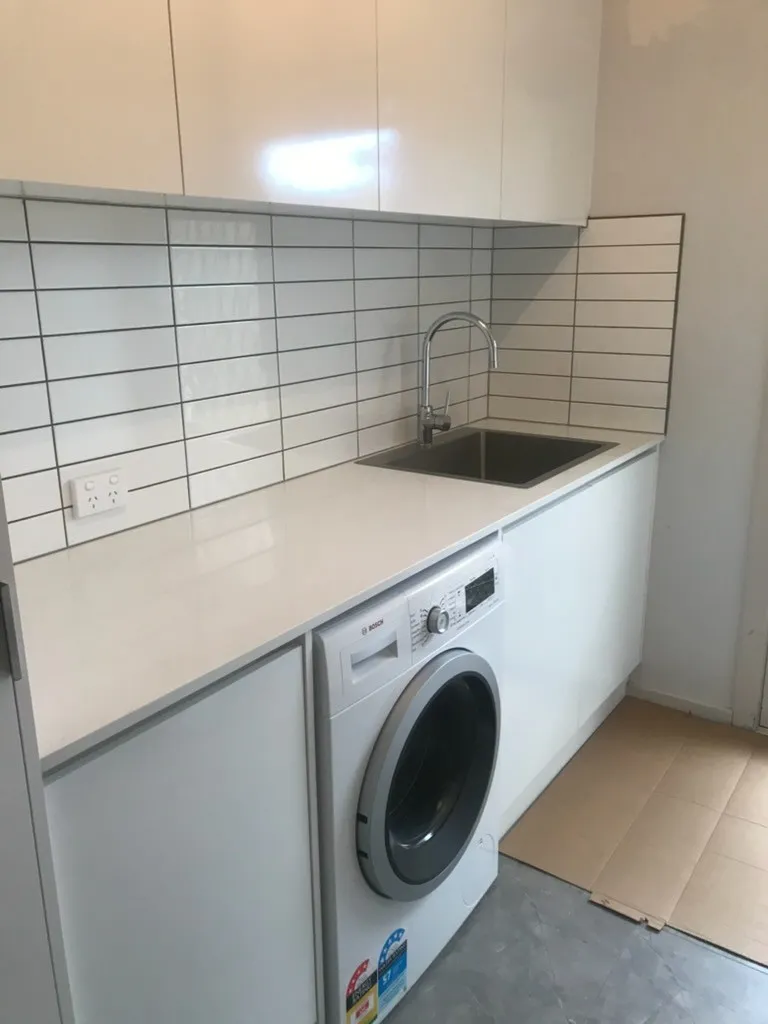 Completed laundry renovation by Bathroom Renovators Group