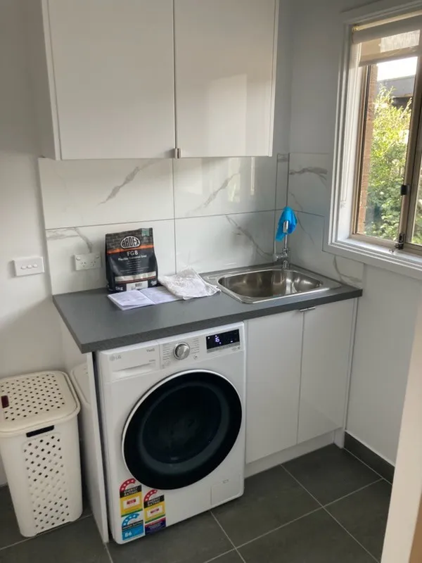 Completed laundry renovation by Bathroom Renovators Group